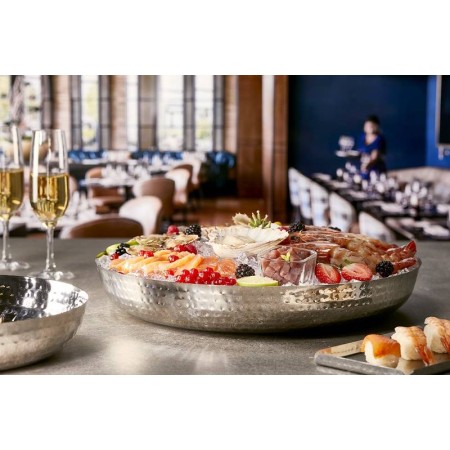 Vassoio rotondo in acciaio martellato, finitura a specchio cm.40